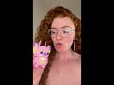 nerdy redhead shows off her BUSH!!